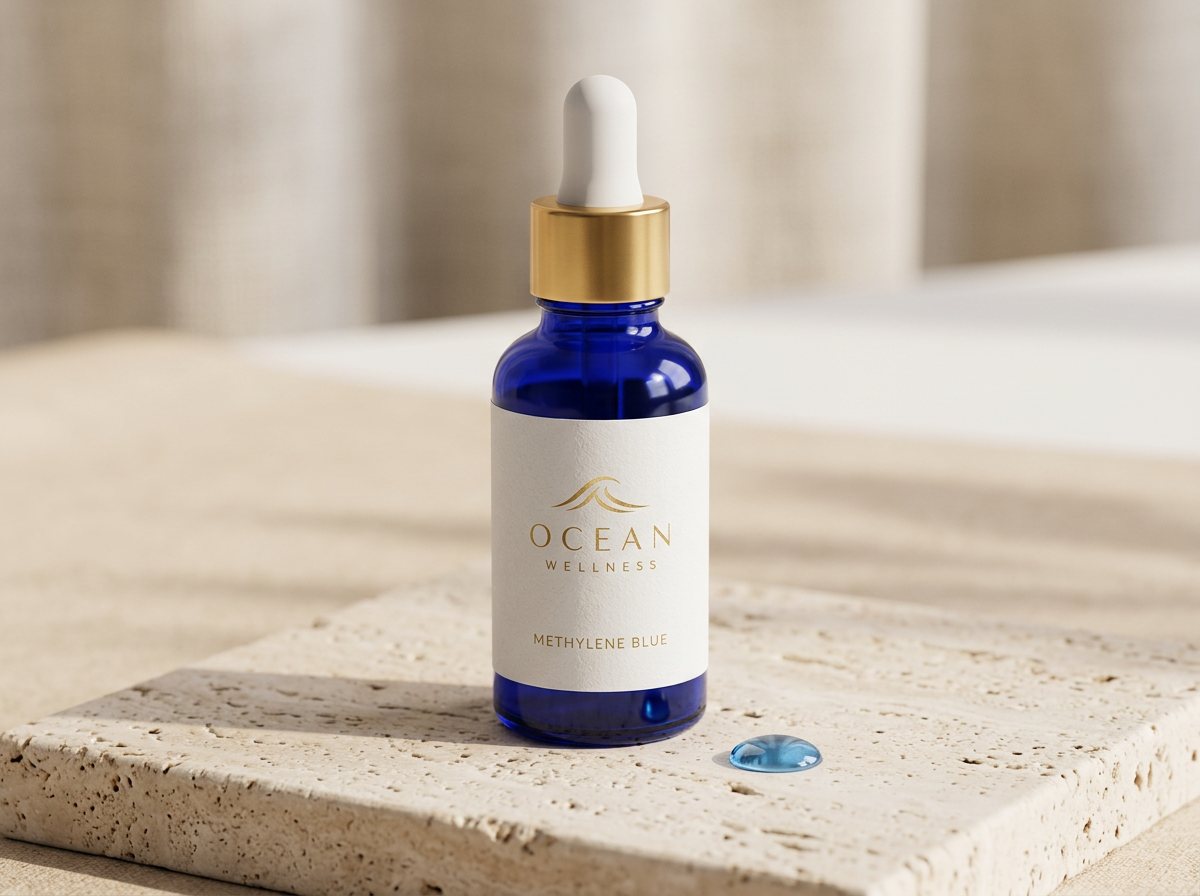 Cobalt blue dropper bottle with a gold collar and the Ocean Wellness logo, labeled Methylene Blue